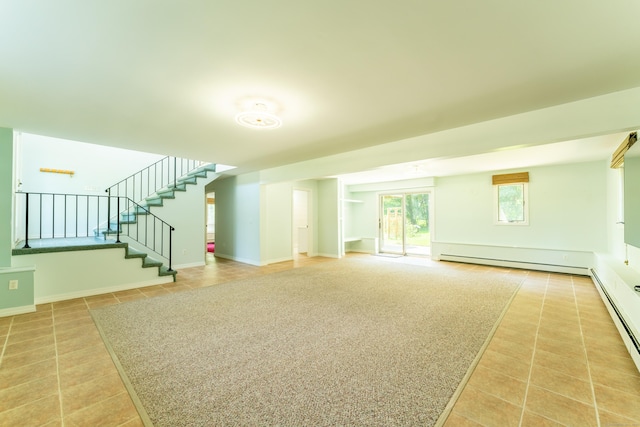 24 Newton St, Norwich, CT 06360 - unfurnished living room featuring a baseboard heating unit, light tile patterned floors, stairs, and baseboard heating