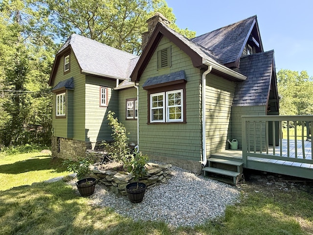 483 Providence Tpke, Hampton, CT 06247 - view of side of home with roof with shingles, a chimney, a deck, and a lawn