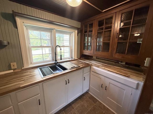 483 Providence Tpke, Hampton, CT 06247 - kitchen featuring wood counters, glass insert cabinets, white cabinets, and dark tile patterned flooring