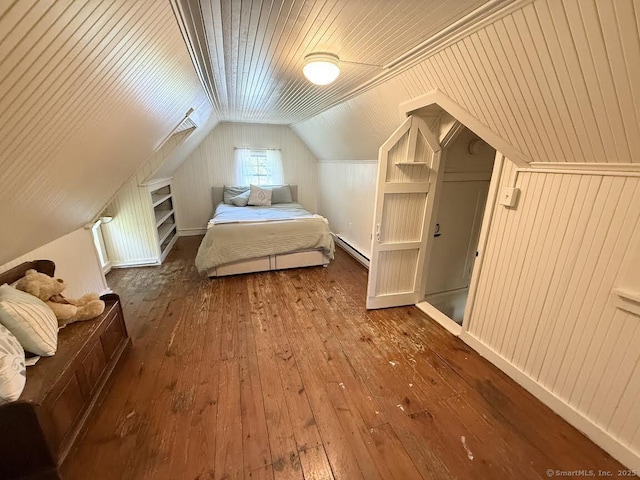 483 Providence Tpke, Hampton, CT 06247 - bedroom featuring a baseboard radiator, wood-type flooring, vaulted ceiling, and wooden walls