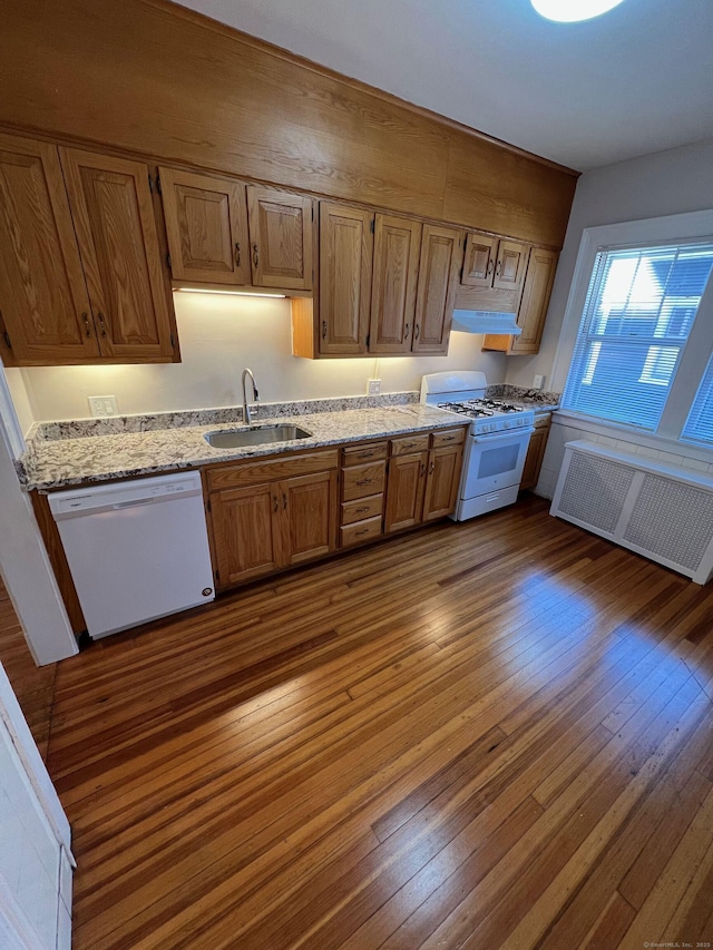 17 Maplewood Ave, West Hartford, CT 06119 - kitchen featuring white appliances, radiator heating unit, dark wood-style flooring, light stone countertops, and brown cabinets