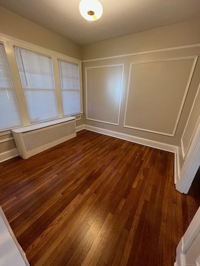 17 Maplewood Ave, West Hartford, CT 06119 - spare room featuring radiator and dark wood-type flooring