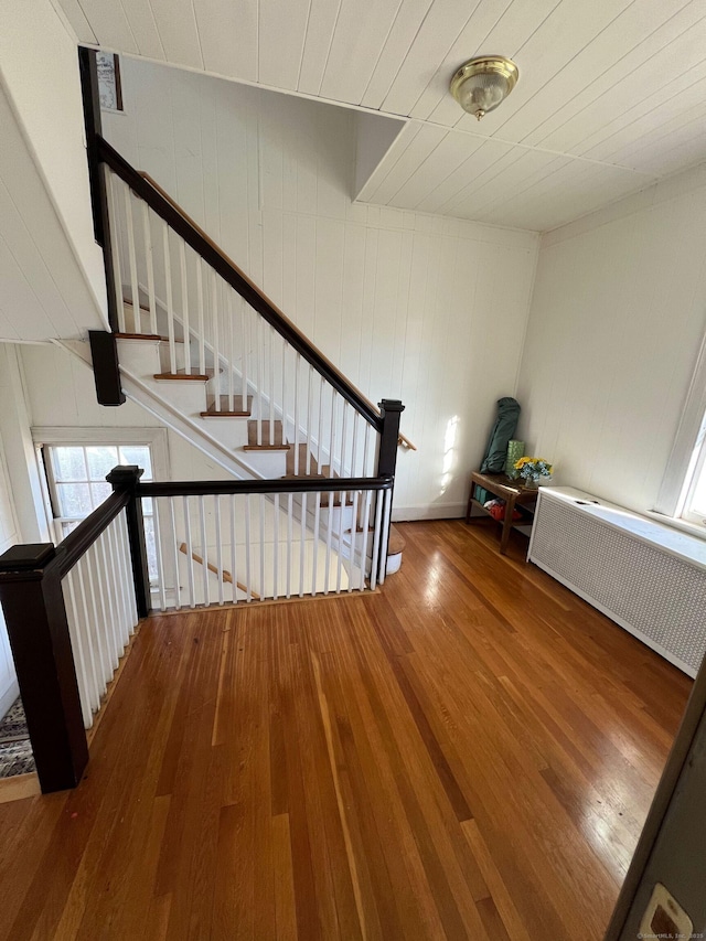 17 Maplewood Ave, West Hartford, CT 06119 - stairway featuring radiator and wood finished floors