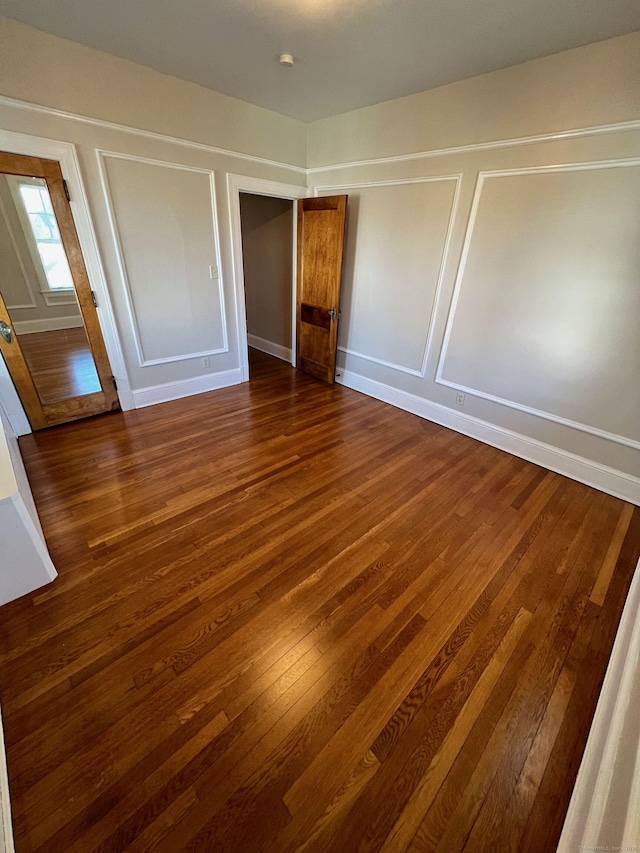 17 Maplewood Ave, West Hartford, CT 06119 - unfurnished bedroom featuring dark wood-type flooring and baseboards