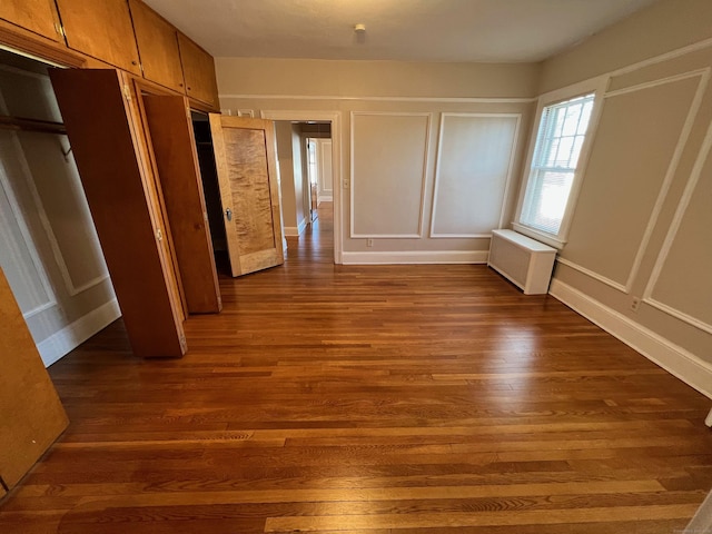 17 Maplewood Ave, West Hartford, CT 06119 - unfurnished bedroom featuring radiator and dark wood-style flooring