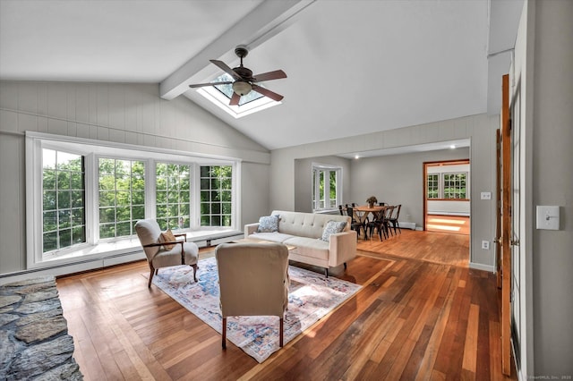 421 Hemlock Point Dr, Coventry, CT 06238 - living area with ceiling fan, wood-type flooring, baseboard heating, a skylight, and wood walls