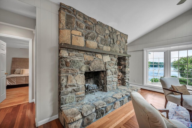 421 Hemlock Point Dr, Coventry, CT 06238 - living room with lofted ceiling, baseboard heating, wood finished floors, and a fireplace