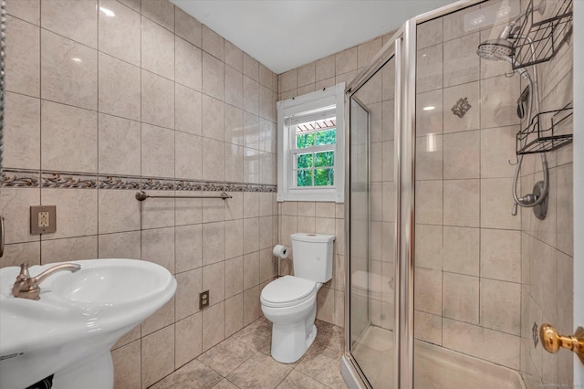 421 Hemlock Point Dr, Coventry, CT 06238 - bathroom with tile walls, a shower stall, and tile patterned floors