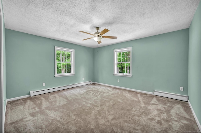421 Hemlock Point Dr, Coventry, CT 06238 - carpeted spare room with a baseboard heating unit, ceiling fan, and a textured ceiling