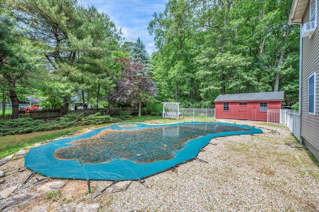 421 Hemlock Point Dr, Coventry, CT 06238 - view of swimming pool with a fenced backyard and an outdoor structure