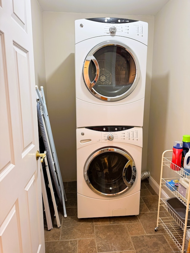 24 Alger Rd, East Haddam, CT 06423 - laundry room with stacked washing machine and dryer and stone tile floors