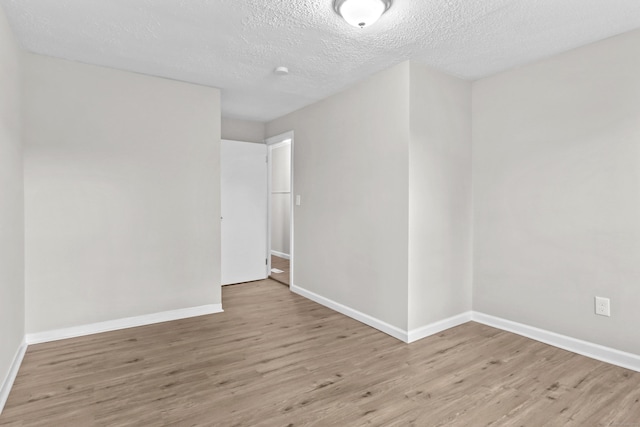 96 Naugatuck Ave, Milford, CT 06460 - spare room featuring wood finished floors and a textured ceiling