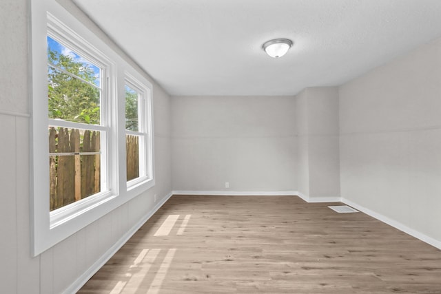 96 Naugatuck Ave, Milford, CT 06460 - empty room with wood finished floors and baseboards