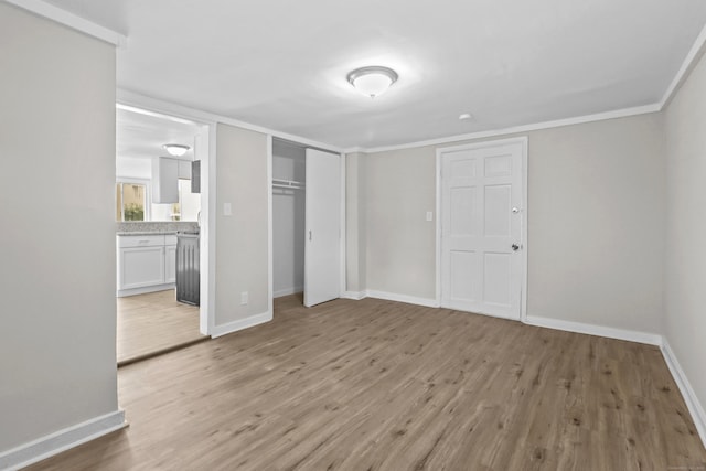 96 Naugatuck Ave, Milford, CT 06460 - unfurnished bedroom with light wood finished floors, a closet, connected bathroom, and ornamental molding