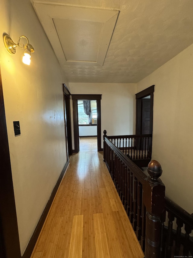 478 E Main St, Norwich, CT 06360 - hall with an upstairs landing, wood finished floors, and attic access