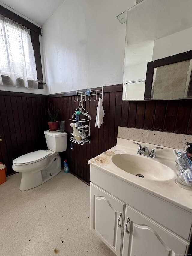 478 E Main St, Norwich, CT 06360 - bathroom featuring wainscoting, vanity, and wood walls