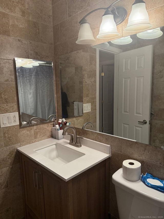 333 Vincellette St Unit 109, Bridgeport, CT 06606 - bathroom with tile walls and vanity