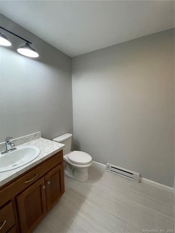 446G Norwich-Westerly Rd, North Stonington, CT 06359 - half bath with a baseboard heating unit and vanity