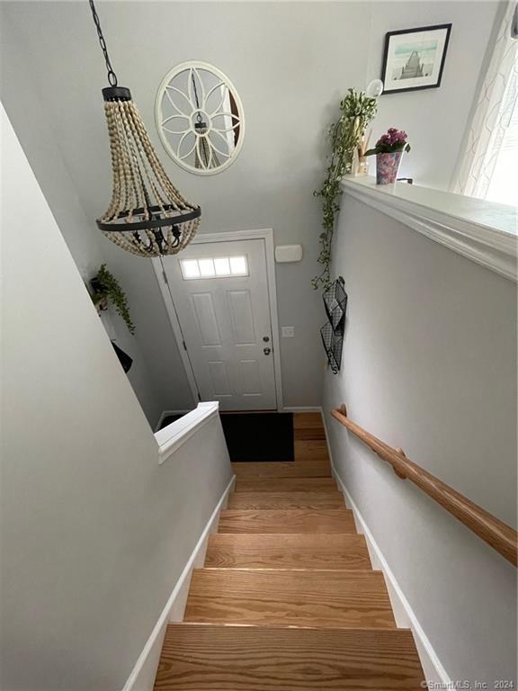 446G Norwich-Westerly Rd, North Stonington, CT 06359 - stairway featuring wood finished floors and baseboards