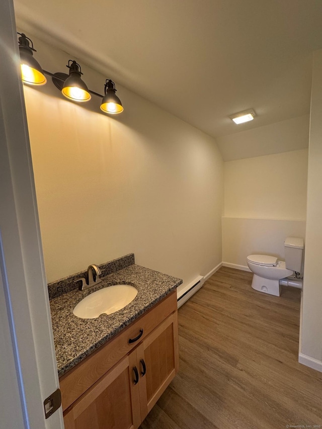 446G Norwich-Westerly Rd, North Stonington, CT 06359 - half bath featuring baseboard heating, vanity, wood finished floors, and lofted ceiling