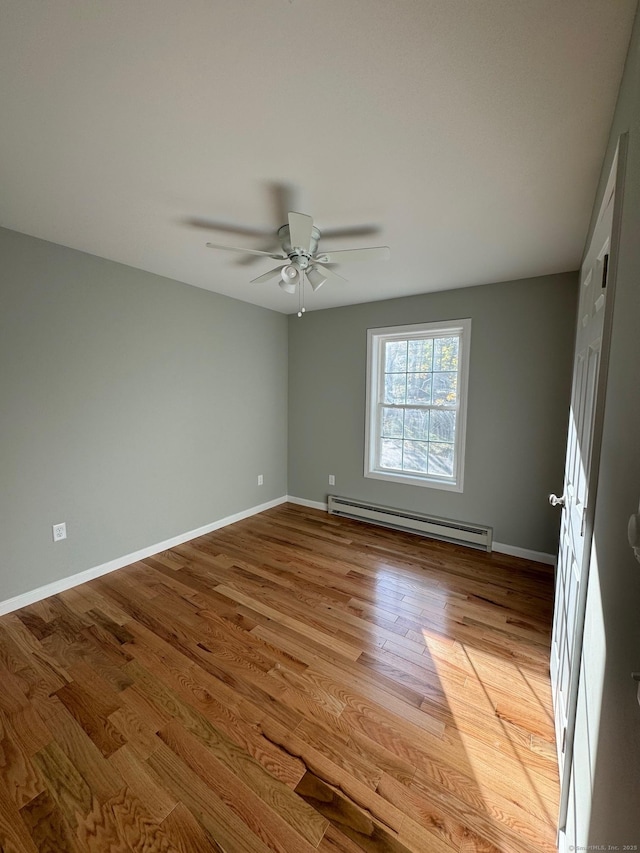 446G Norwich-Westerly Rd, North Stonington, CT 06359 - empty room featuring baseboard heating, ceiling fan, and light wood-style floors