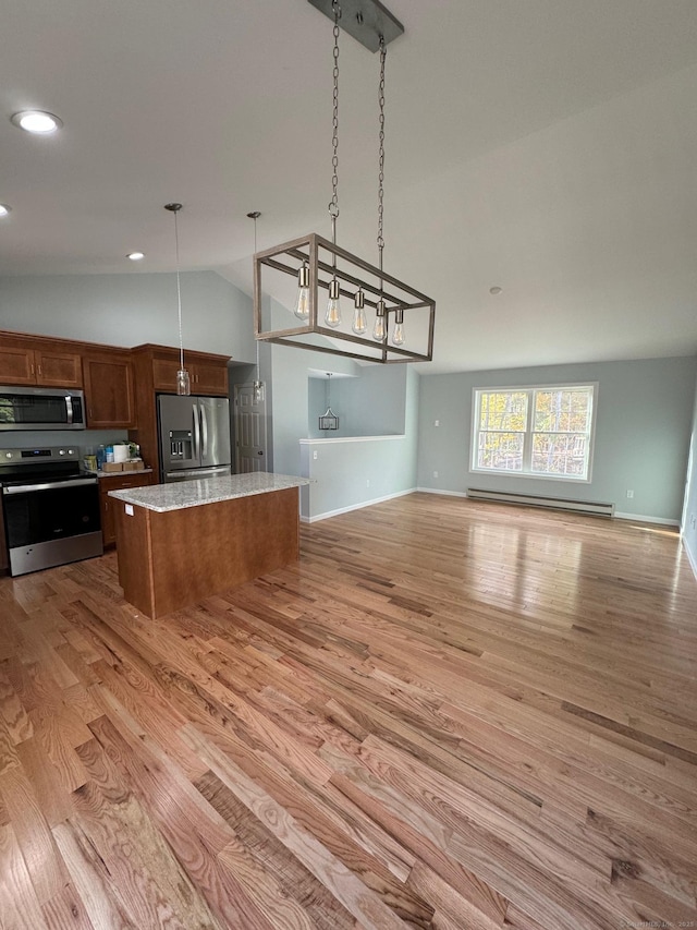 446G Norwich-Westerly Rd, North Stonington, CT 06359 - kitchen with stainless steel appliances, baseboard heating, open floor plan, vaulted ceiling, and light wood-style floors