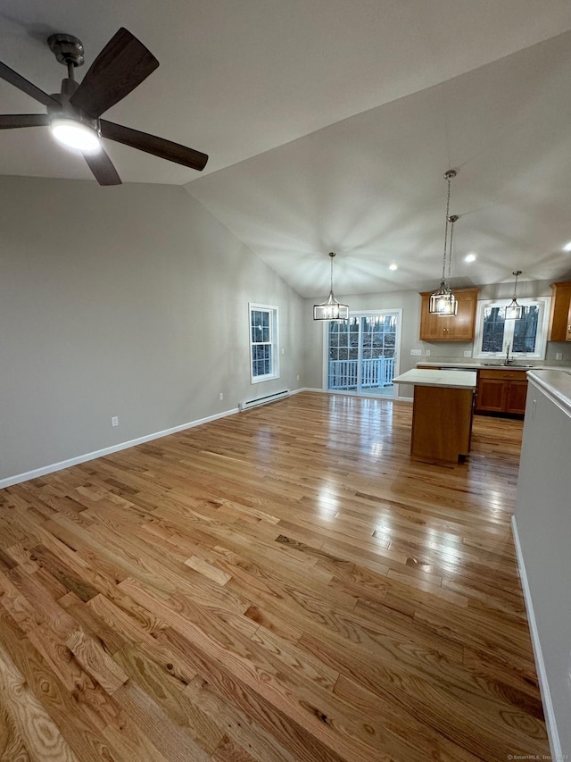 446G Norwich-Westerly Rd, North Stonington, CT 06359 - unfurnished living room with a baseboard radiator, light wood-style floors, ceiling fan, a chandelier, and recessed lighting