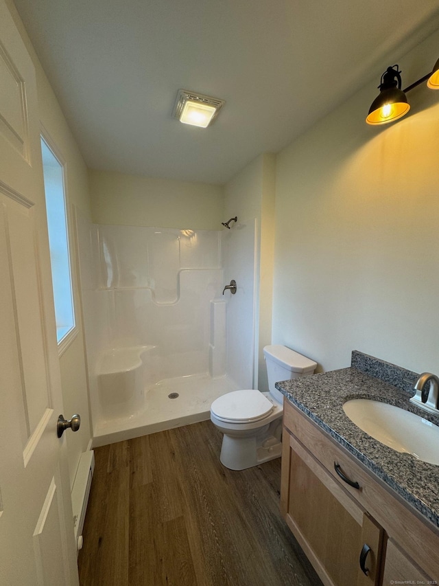 446G Norwich-Westerly Rd, North Stonington, CT 06359 - bathroom featuring wood finished floors, a baseboard radiator, a shower, and vanity