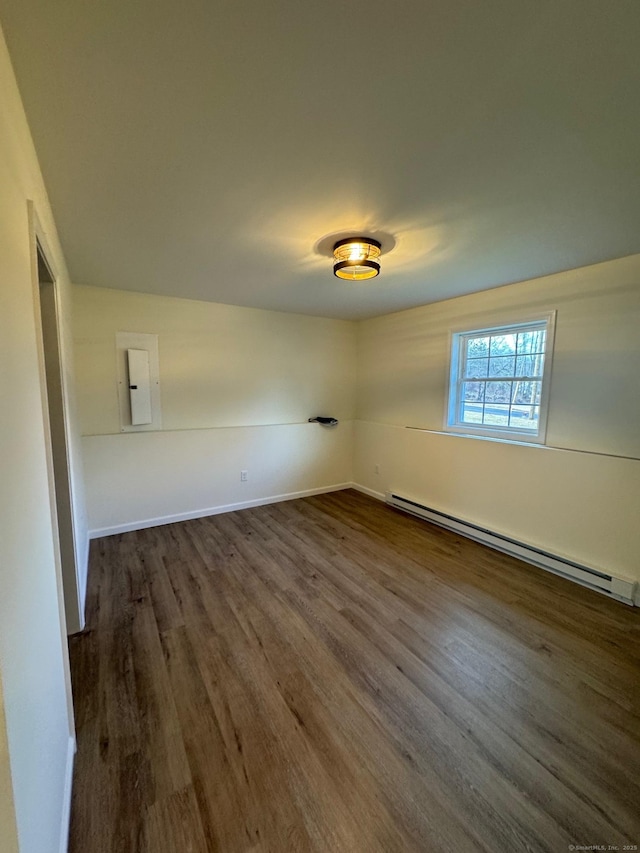 446G Norwich-Westerly Rd, North Stonington, CT 06359 - unfurnished room with a baseboard radiator, dark wood-type flooring, and electric panel