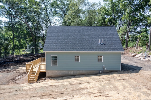 248 Rukstella Rd, Brooklyn, CT 06234 - view of side of home with a deck, view of wooded area, and stairs