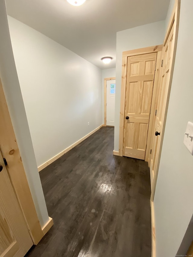 248 Rukstella Rd, Brooklyn, CT 06234 - hallway with dark wood finished floors and baseboards