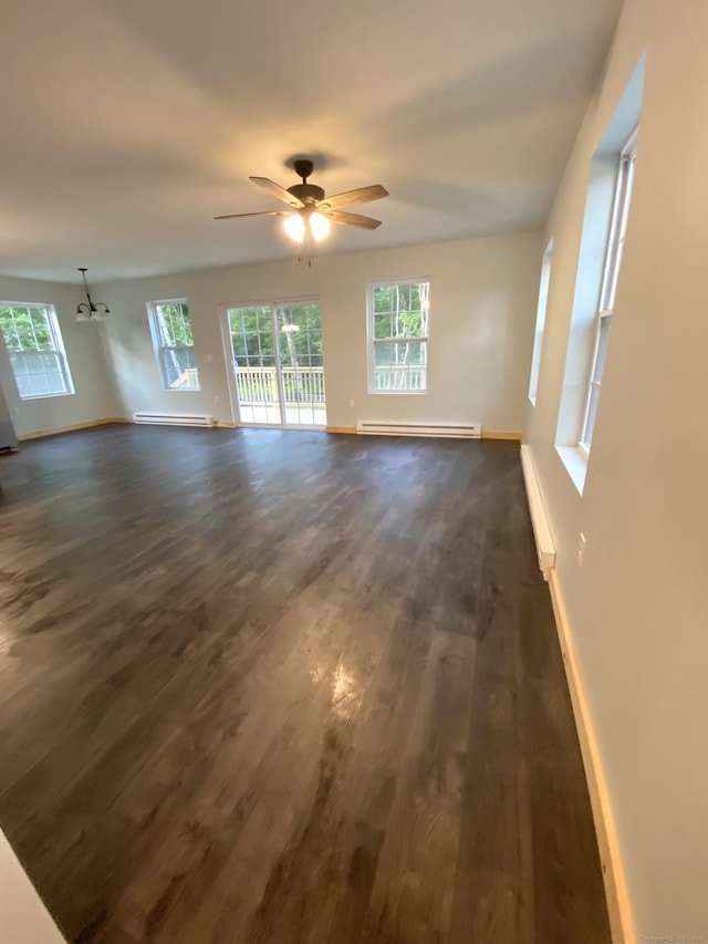 248 Rukstella Rd, Brooklyn, CT 06234 - unfurnished living room with a baseboard heating unit, dark wood-style flooring, and plenty of natural light