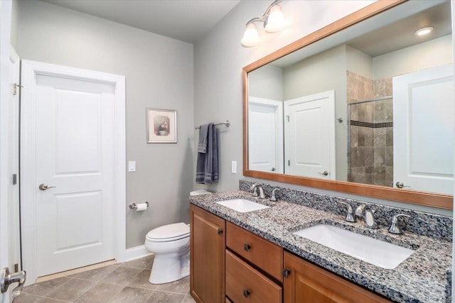 17 Brookside Ct Unit 17, Newtown, CT 06470 - bathroom featuring double vanity, tiled shower, and tile patterned floors