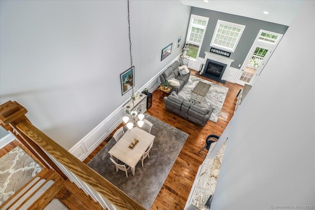17 Brookside Ct Unit 17, Newtown, CT 06470 - living room featuring a fireplace with flush hearth, wood finished floors, and recessed lighting