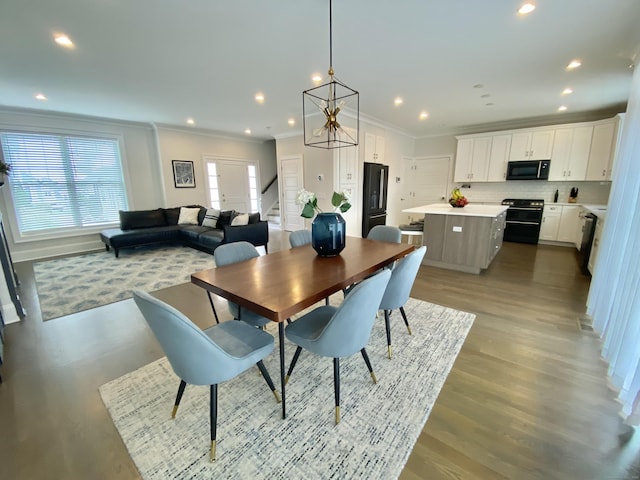 159 Colonial Rd Unit 5, Stamford, CT 06906 - dining room with ornamental molding, wood finished floors, recessed lighting, stairway, and a chandelier