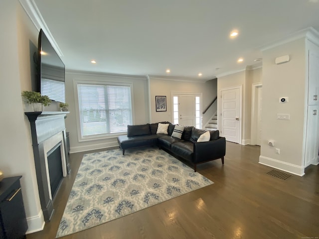 159 Colonial Rd Unit 5, Stamford, CT 06906 - living room featuring crown molding, stairway, dark wood-type flooring, a fireplace, and recessed lighting