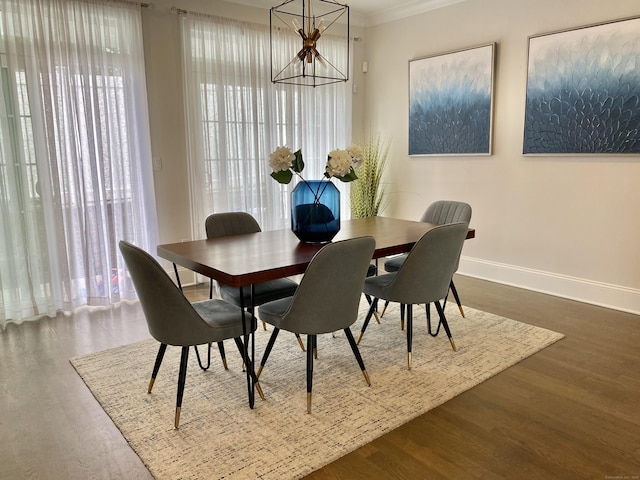 159 Colonial Rd Unit 5, Stamford, CT 06906 - dining area with wood finished floors, a chandelier, healthy amount of natural light, and ornamental molding