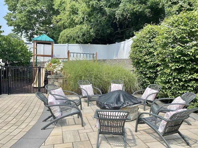 159 Colonial Rd Unit 5, Stamford, CT 06906 - view of patio / terrace with an outdoor fire pit and a playground