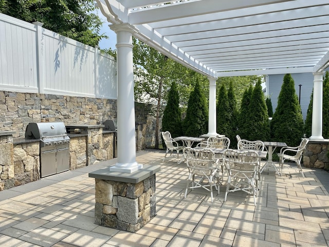 159 Colonial Rd Unit 5, Stamford, CT 06906 - view of patio featuring outdoor dining space, exterior kitchen, and a pergola
