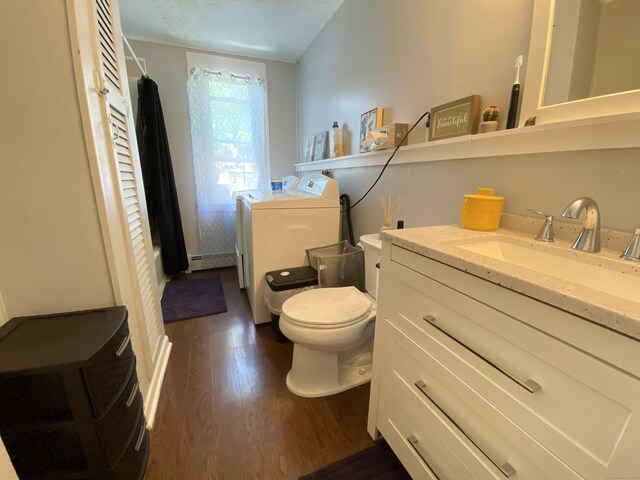 114 Pulaski St, Torrington, CT 06790 - bathroom with wood finished floors, vanity, and independent washer and dryer