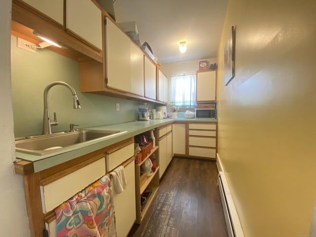 114 Pulaski St, Torrington, CT 06790 - kitchen featuring dark wood-style floors, baseboard heating, light countertops, and black microwave