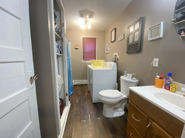 114 Pulaski St, Torrington, CT 06790 - bathroom with baseboard heating, wood finished floors, separate washer and dryer, vanity, and a shower with curtain
