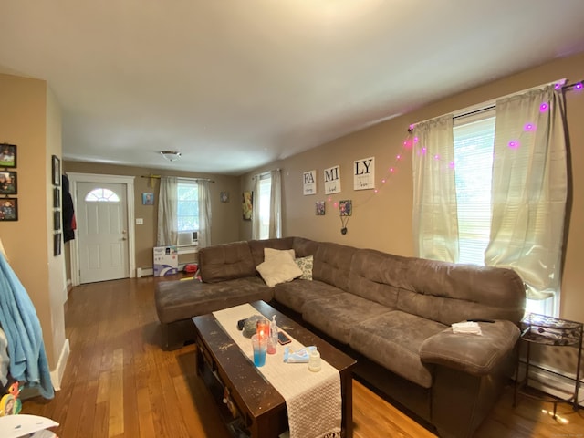 114 Pulaski St, Torrington, CT 06790 - living room featuring wood finished floors, a baseboard heating unit, and cooling unit