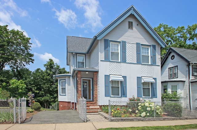 34 Hobart St, Meriden, CT 06450 - view of front facade with a shingled roof