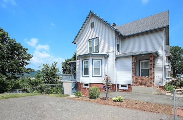 34 Hobart St, Meriden, CT 06450 - view of front of property with roof with shingles and a chimney