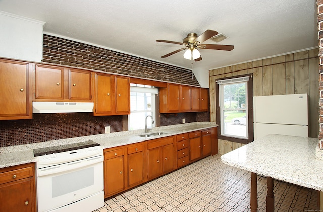 34 Hobart St, Meriden, CT 06450 - kitchen with white appliances, under cabinet range hood, a ceiling fan, tasteful backsplash, and healthy amount of natural light