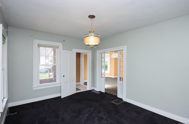 34 Hobart St, Meriden, CT 06450 - spare room featuring a chandelier and dark carpet