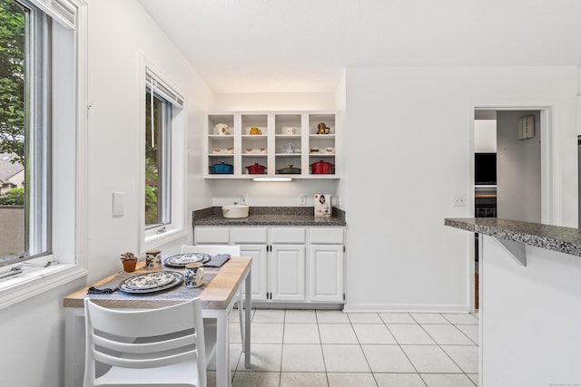 17 Font Hill Park Unit 17, Bloomfield, CT 06002 - kitchen with open shelves, white cabinets, and light tile patterned flooring