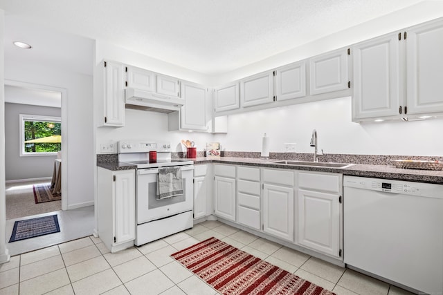 17 Font Hill Park Unit 17, Bloomfield, CT 06002 - kitchen featuring white appliances, under cabinet range hood, dark countertops, white cabinetry, and light tile patterned flooring