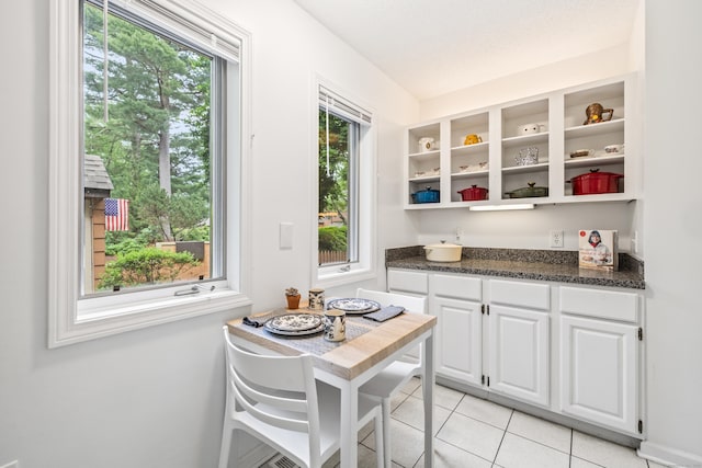 17 Font Hill Park Unit 17, Bloomfield, CT 06002 - kitchen with open shelves, white cabinetry, plenty of natural light, and light tile patterned flooring